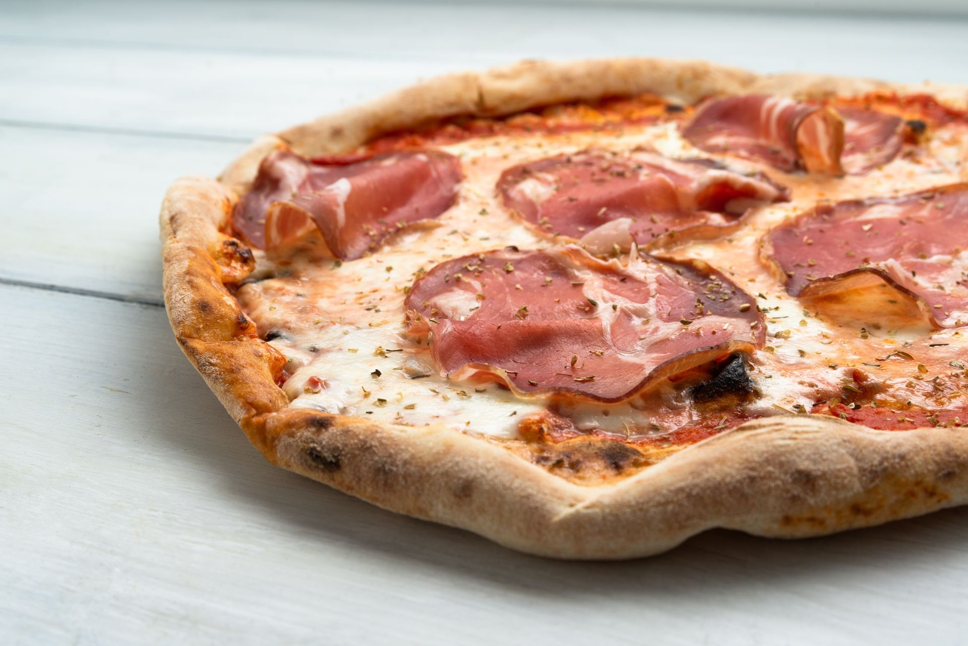 Pizza with bresaola, italian salami 